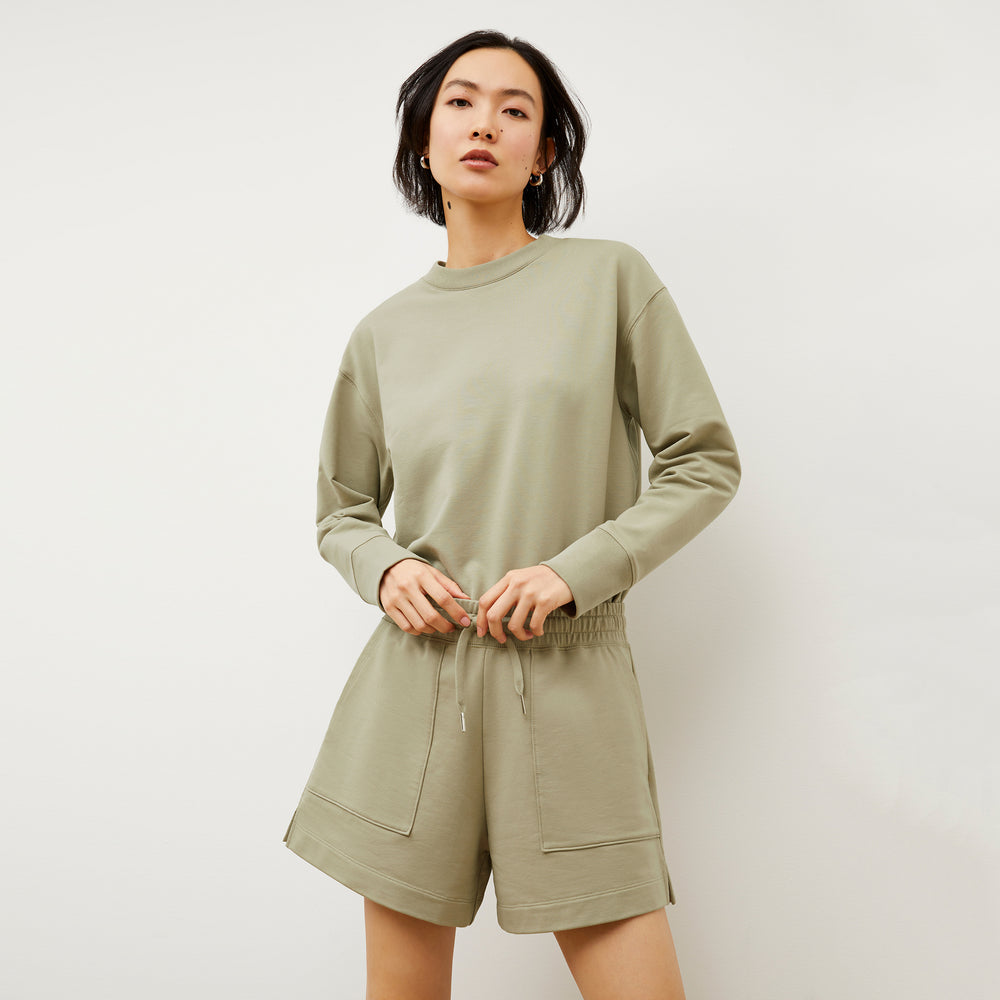 Front image of a woman wearing the Felix Short - Light French Terry in Laurel Green