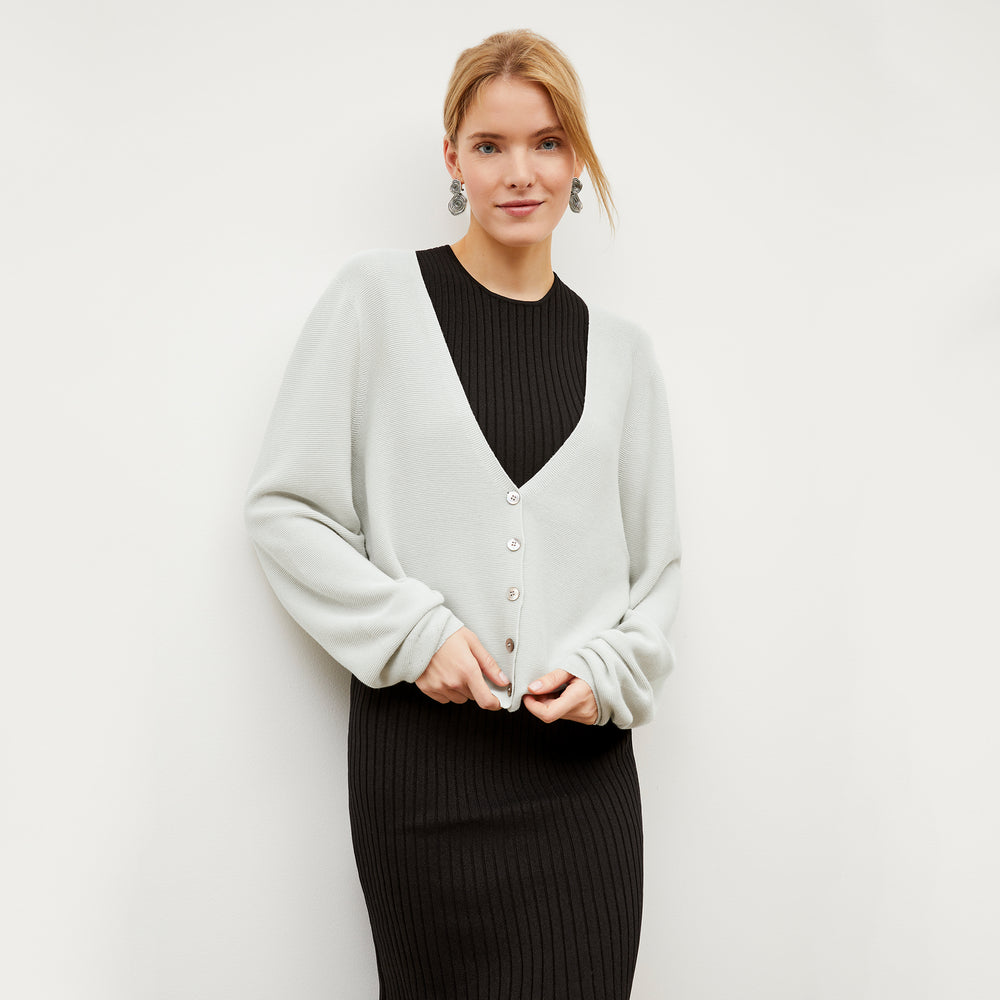Front image of a woman wearing the Dylan Dress in Black