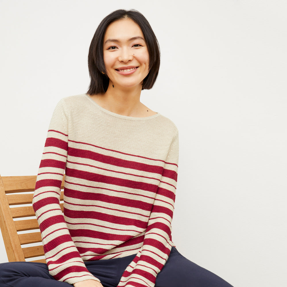 Image of a woman wearing the Samara Sweater in Crimson / Ivory