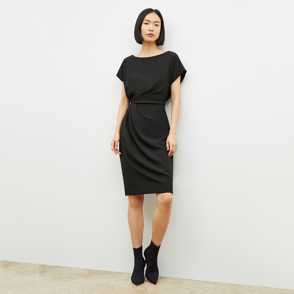 Front image of a woman wearing the jillian dress in black