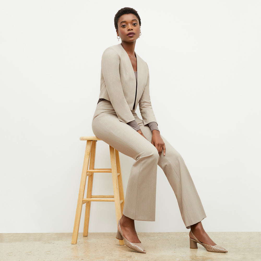 Side image of a woman wearing the Neale Jacket in Natural Melange