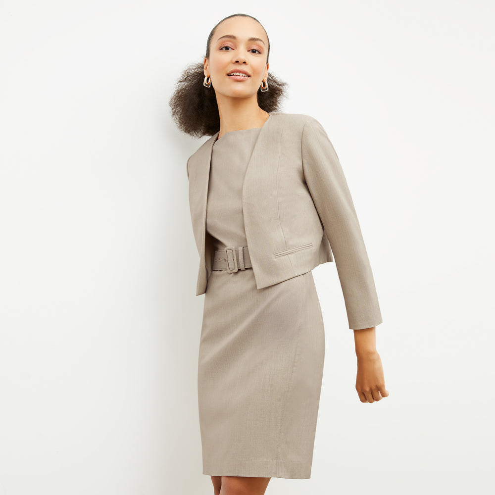 Side image of a woman wearing the Neale Jacket in Natural Melange