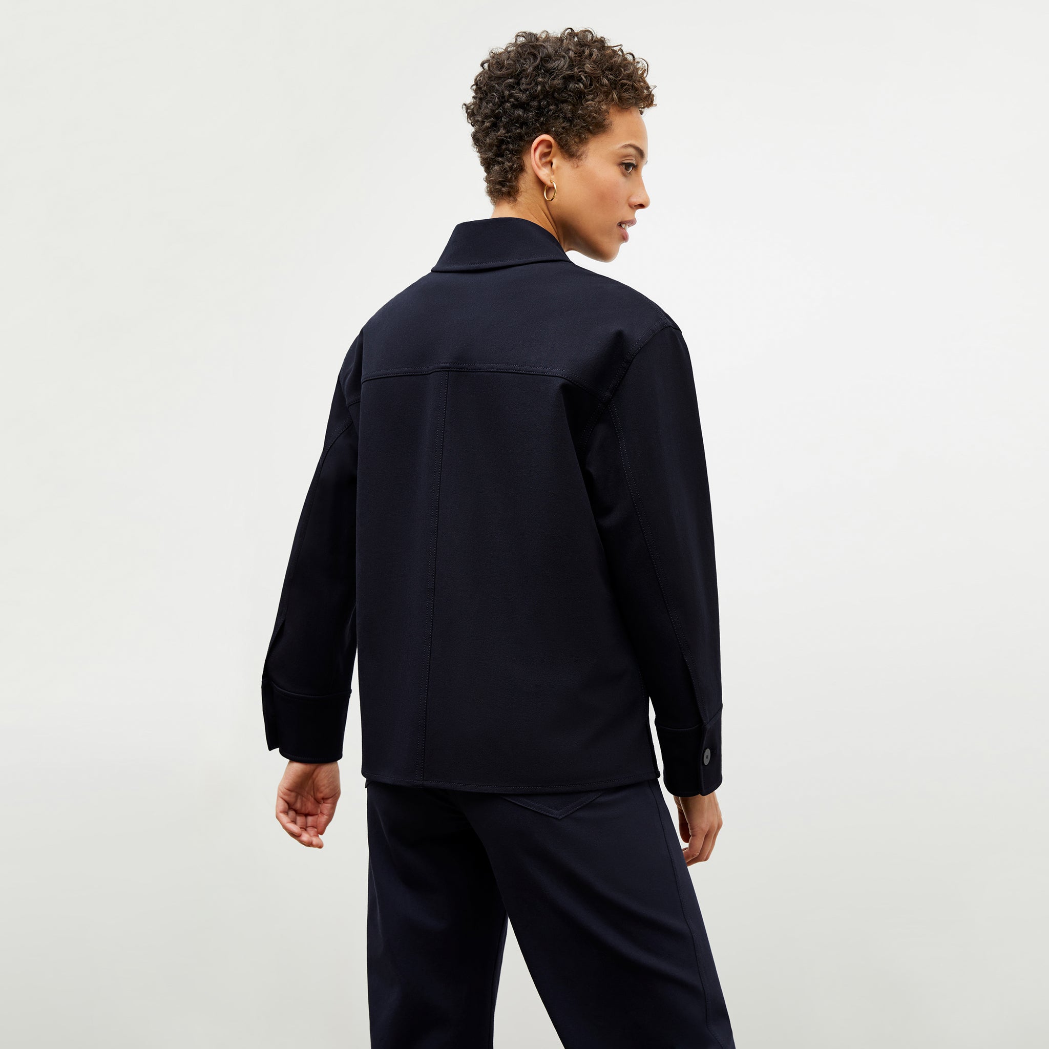 Back image of a woman wearing the steffi jacket in ink