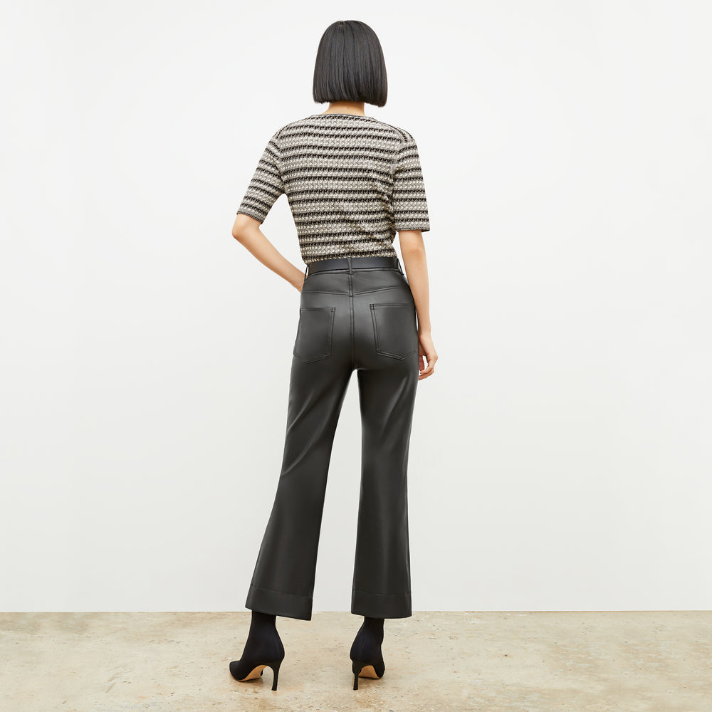 Back image of a woman wearing the charli in black and white