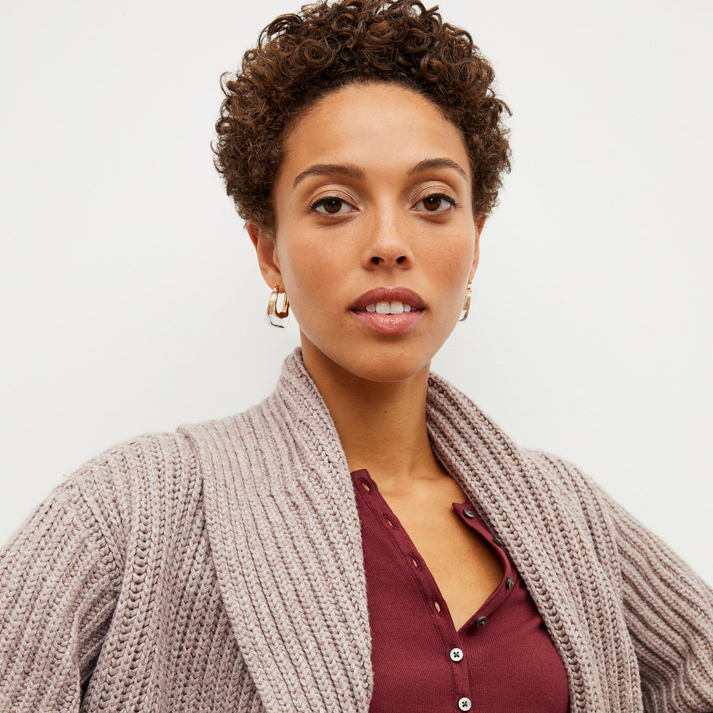 Front image of a woman standing wearing the Snyder Jacket—Lush Merino in Barley