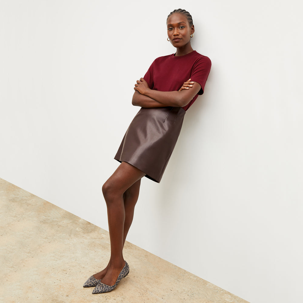 Front image of a woman wearing the Whitney Skirt in Brown