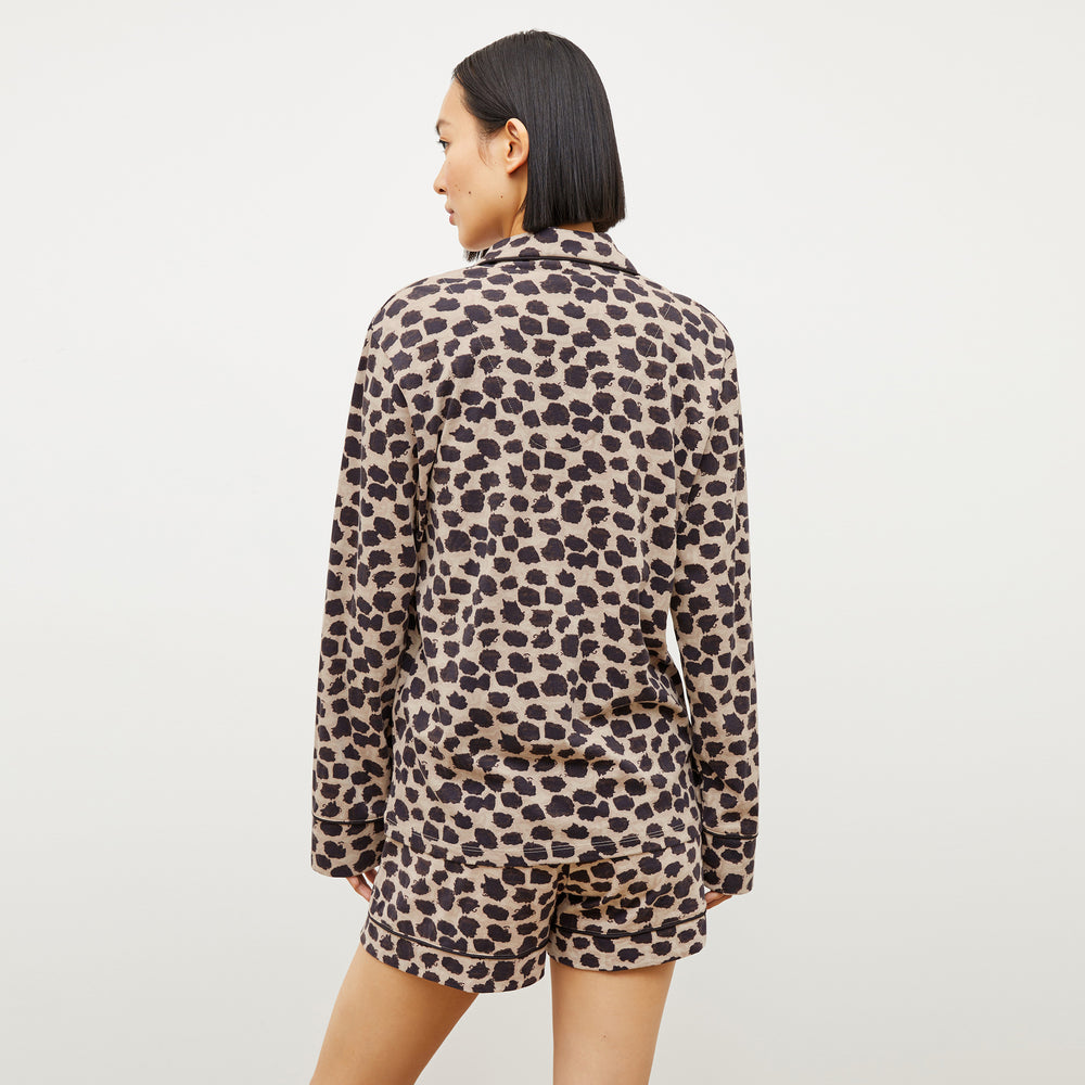 Back image of a woman wearing the Petite Plume x M.M. Long Sleeve Short Set in Sahara Print