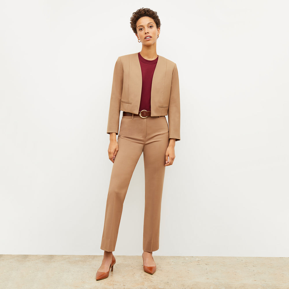 Front image of a woman wearing the smith in camel