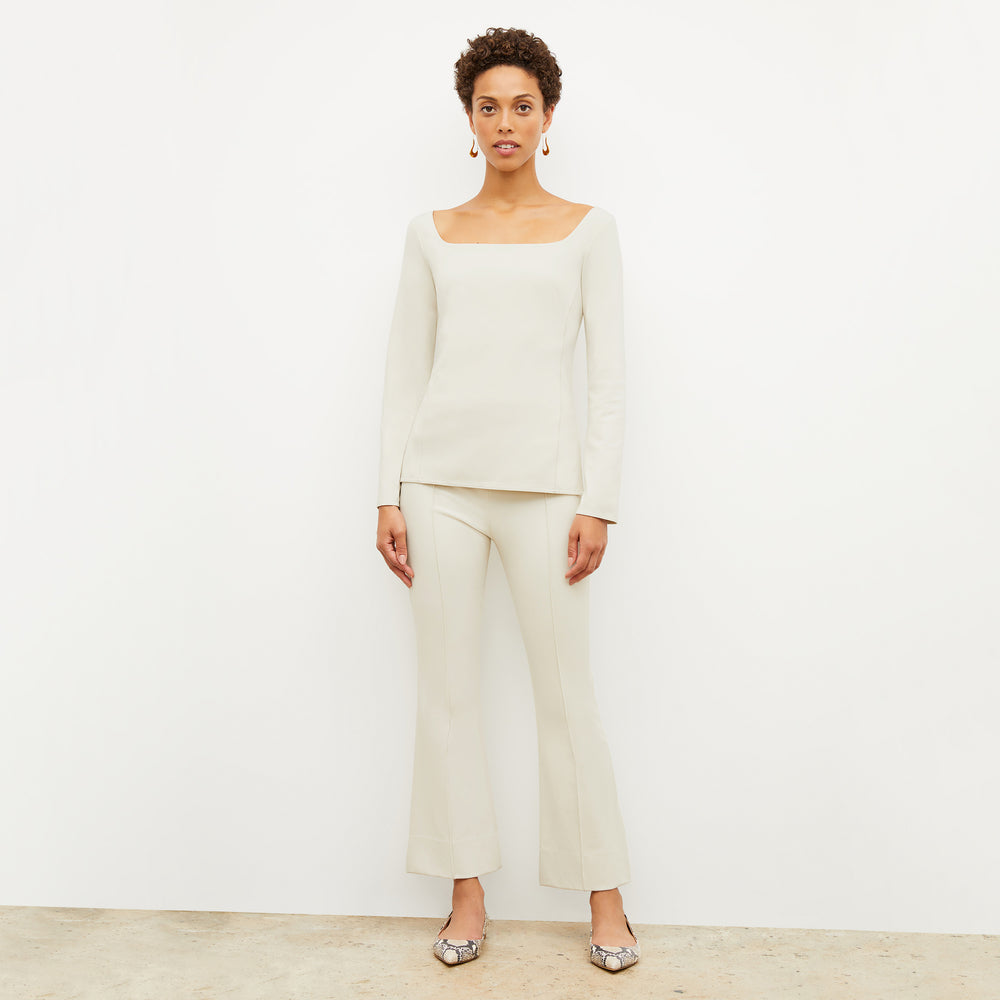 Front image of a woman standing wearing the Shiloh Pant in Pearl