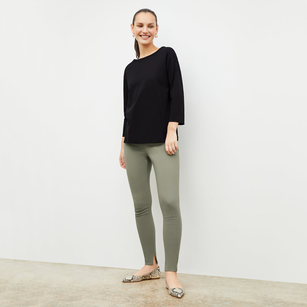 Front image of a woman wearing the Owen T-Shirt in Black