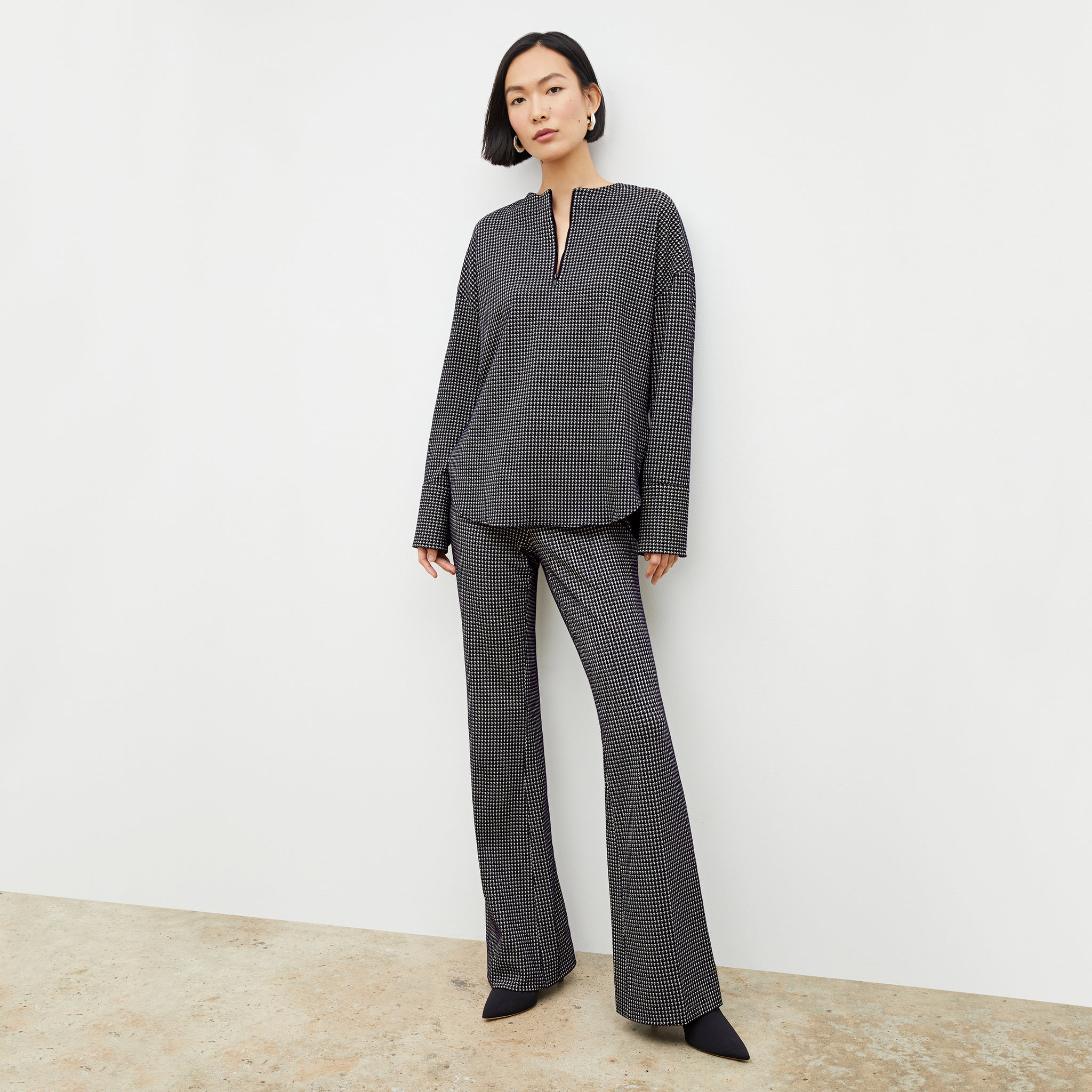 Front image of a woman wearing the tully top in black and white