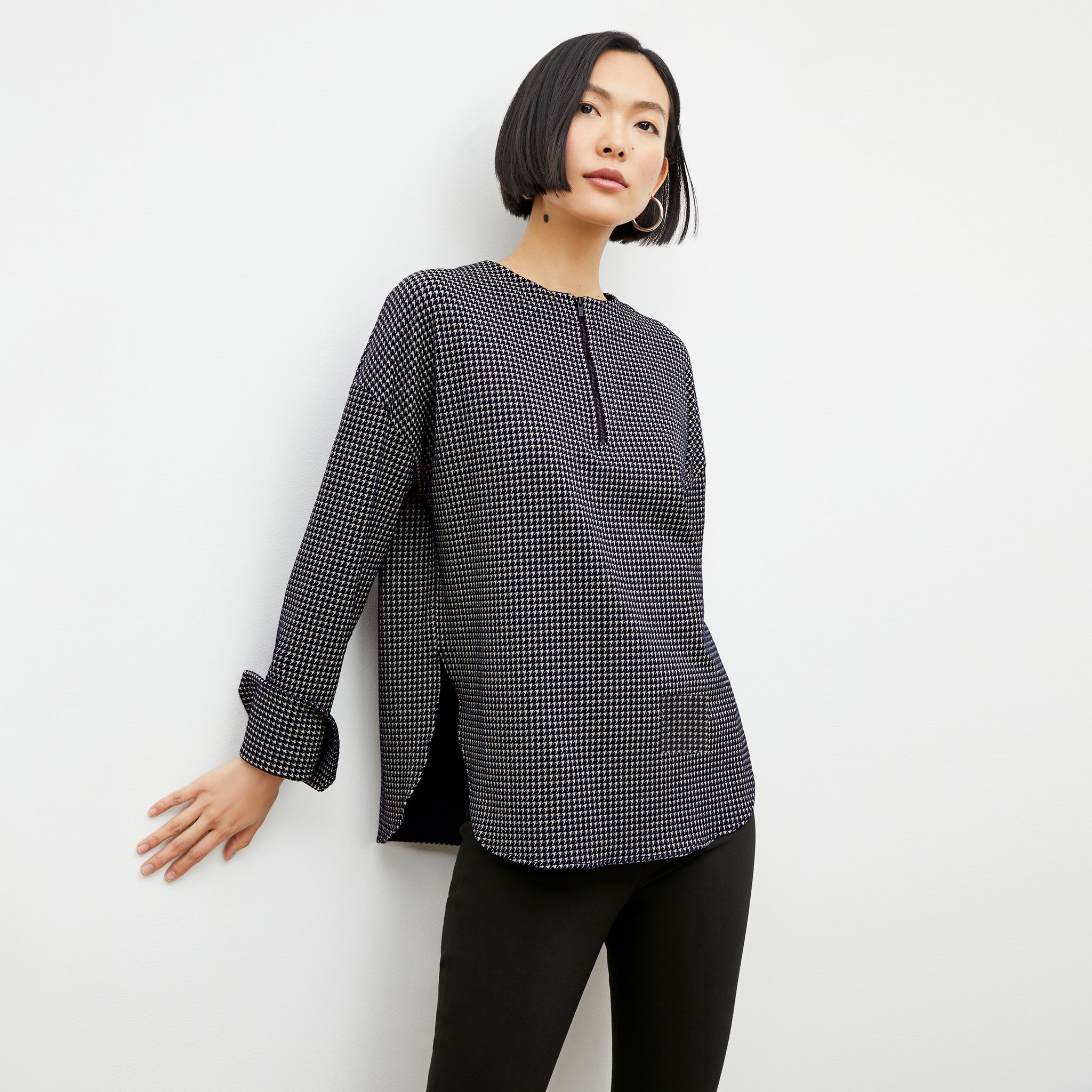 Front image of a woman wearing the tully top in black and white