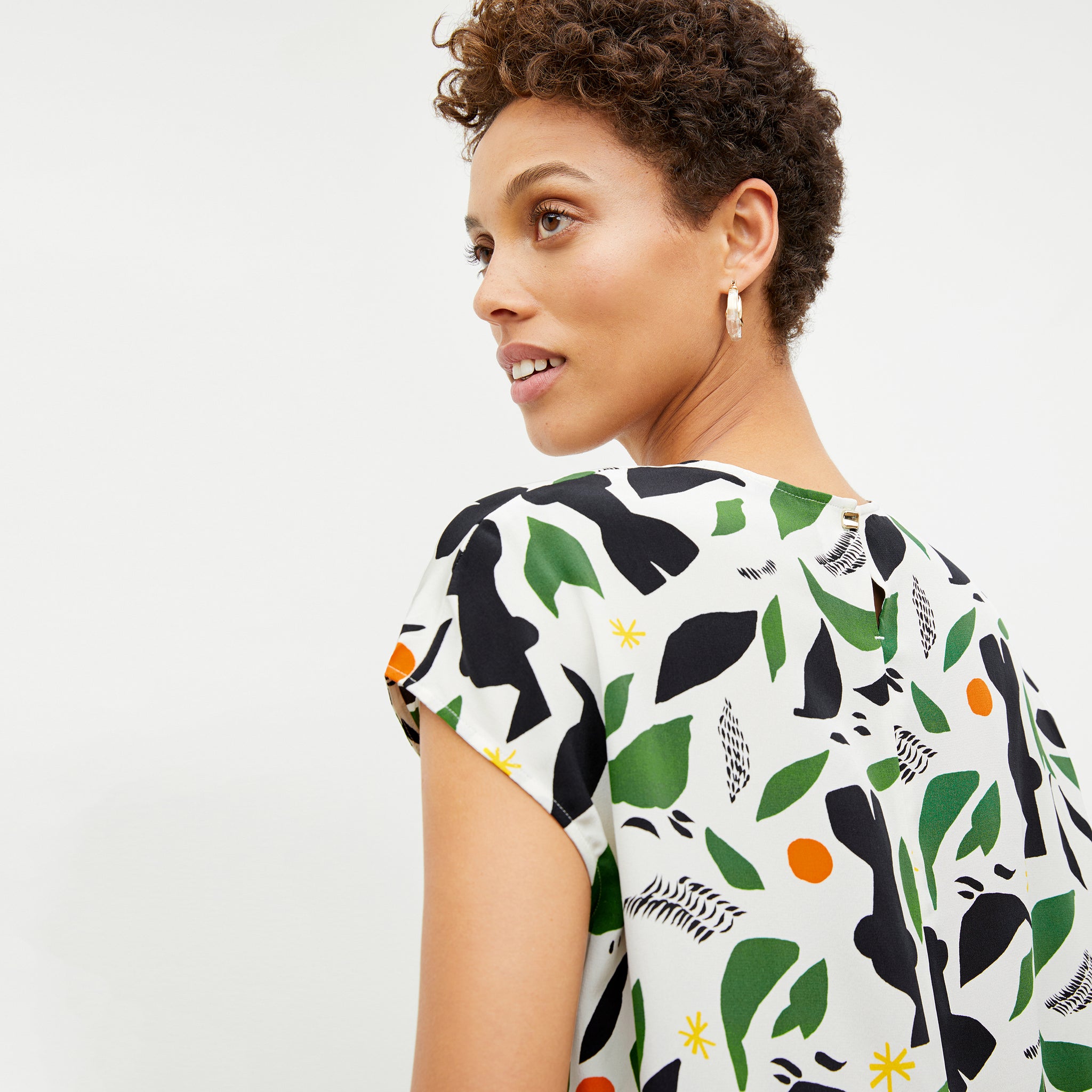 Back image of a woman wearing the didion top on icon print