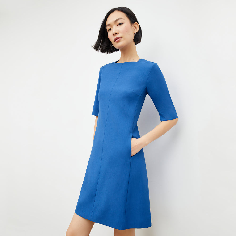 Front image of a woman in the emily dress in santorini