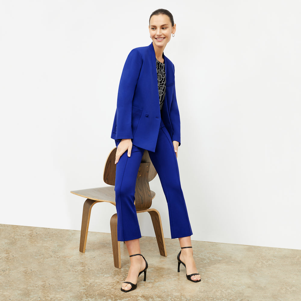 front image of a woman wearing the allyn pants in electric blue
