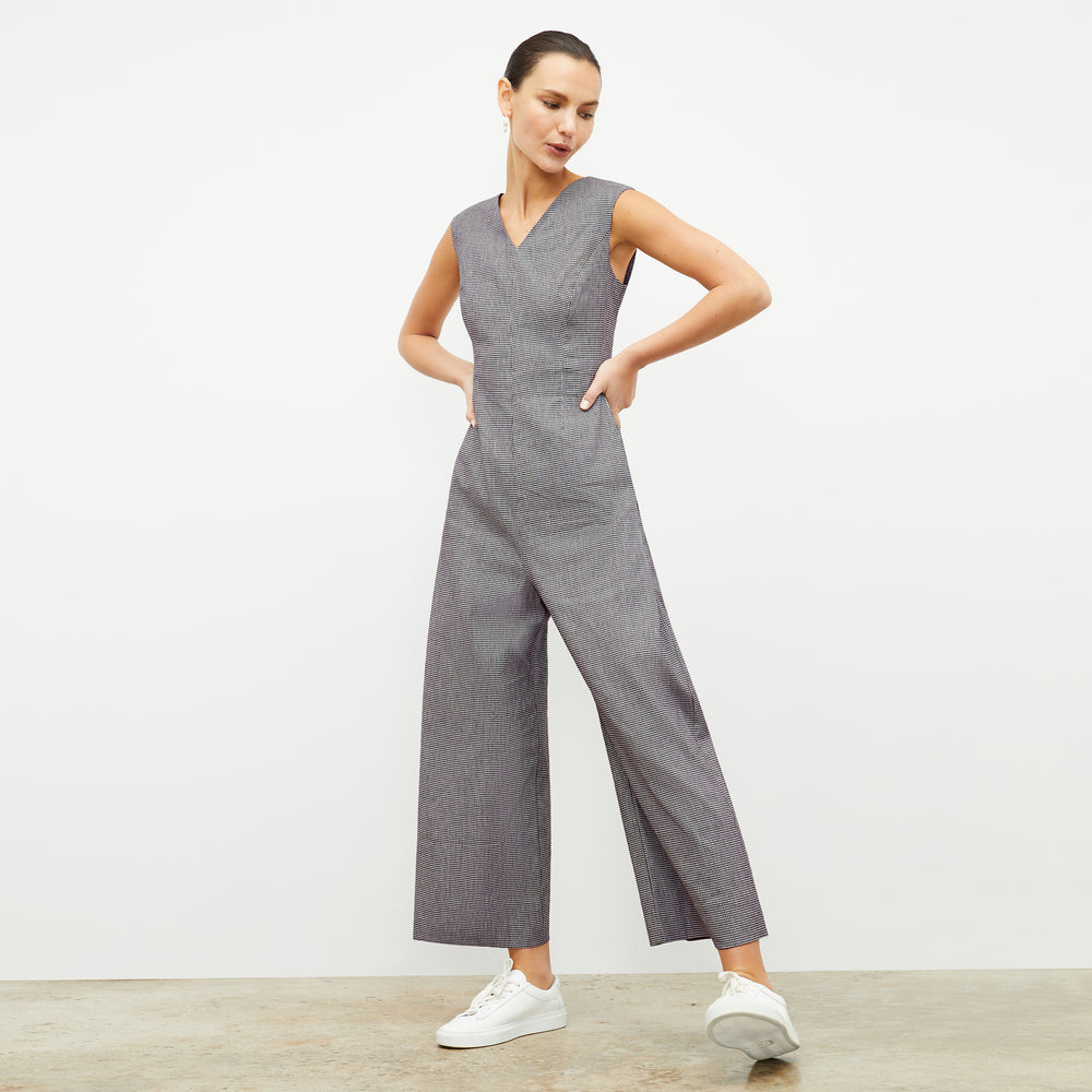 front image of a woman wearing the demi jumpsuit in gingham linen