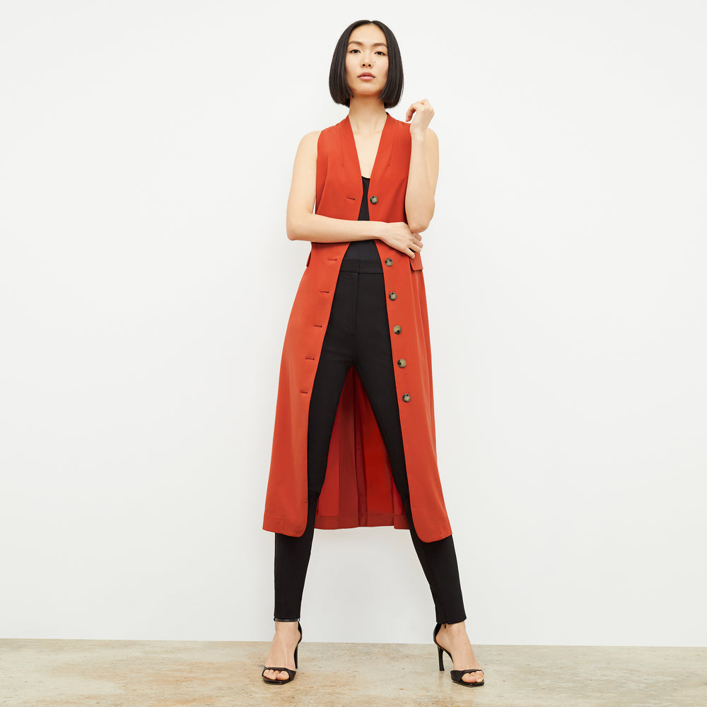 Front image of a woman wearing the Cassandra Dress in Blood Orange