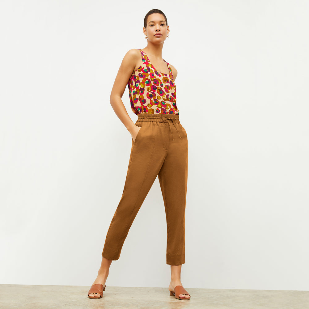 Front image of a woman wearing the Vicky Tank in Peacock Print