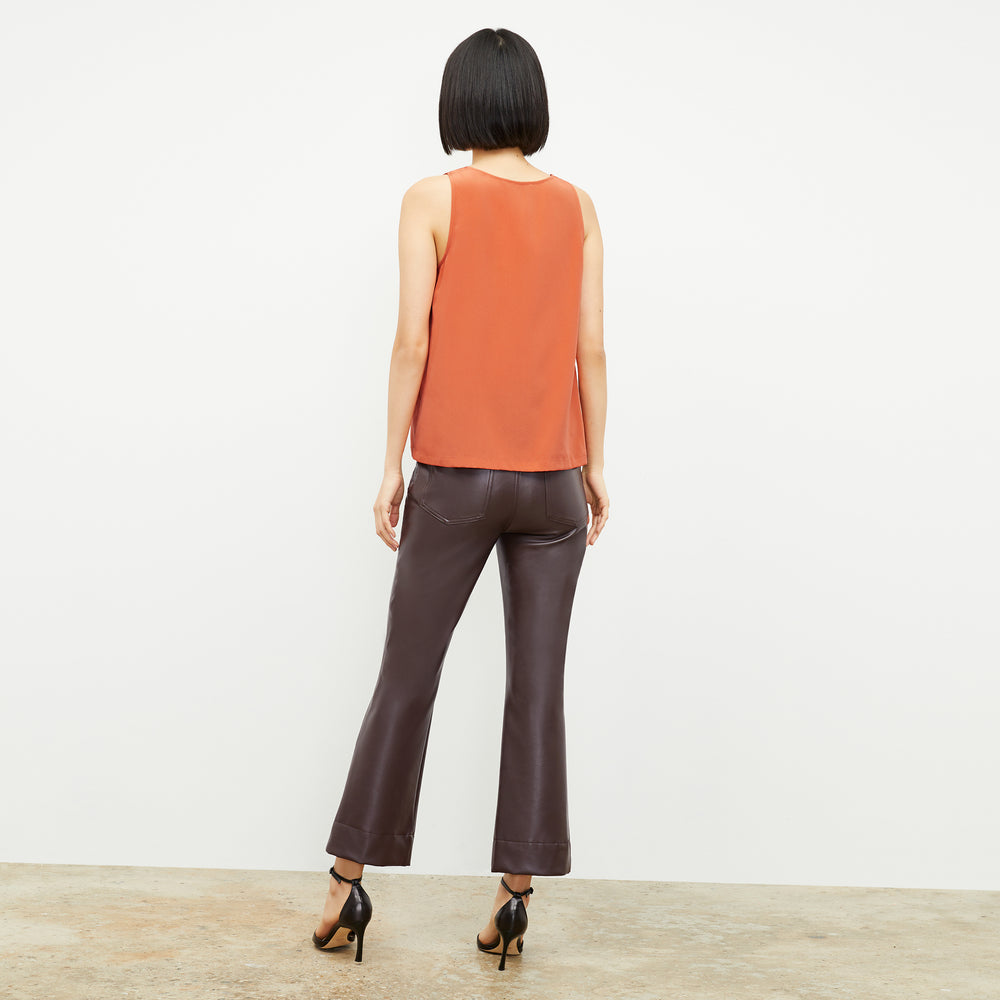 Back image of a woman wearing the Vicky Tank in Guava
