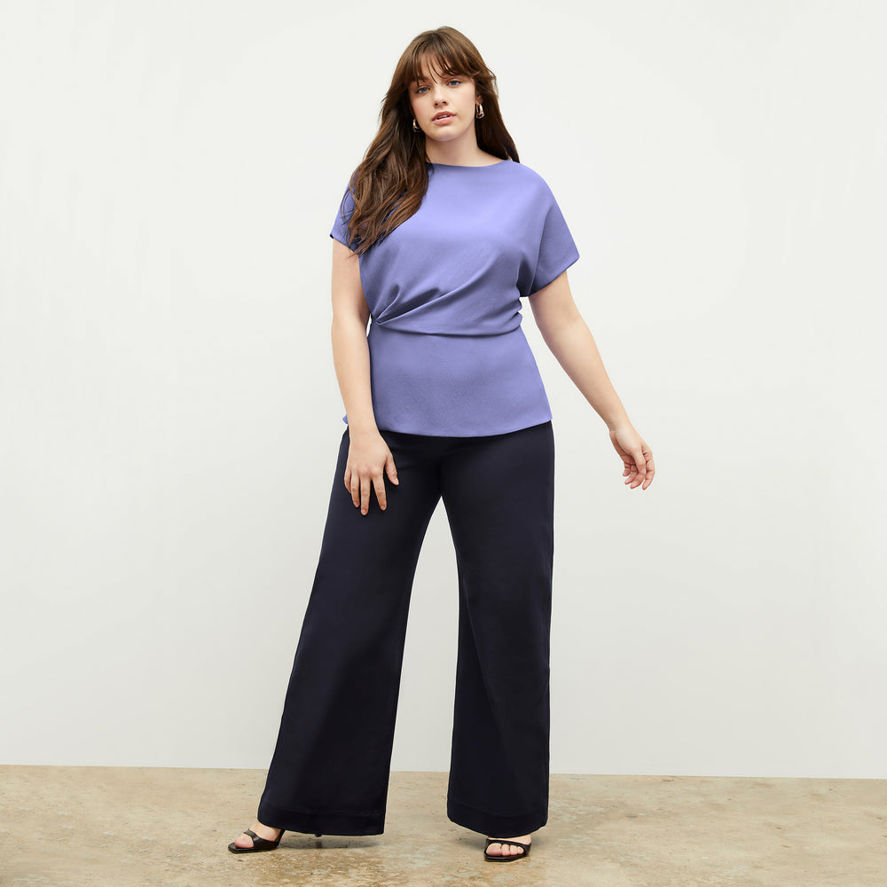 Front image of a woman wearing the Nejvi Top in Iris