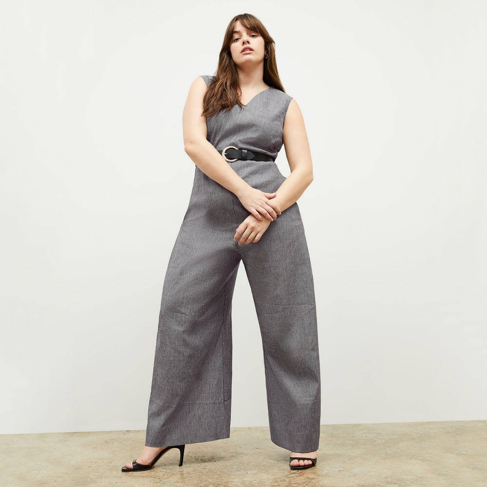 front image of a woman wearing the demi jumpsuit in gingham linen