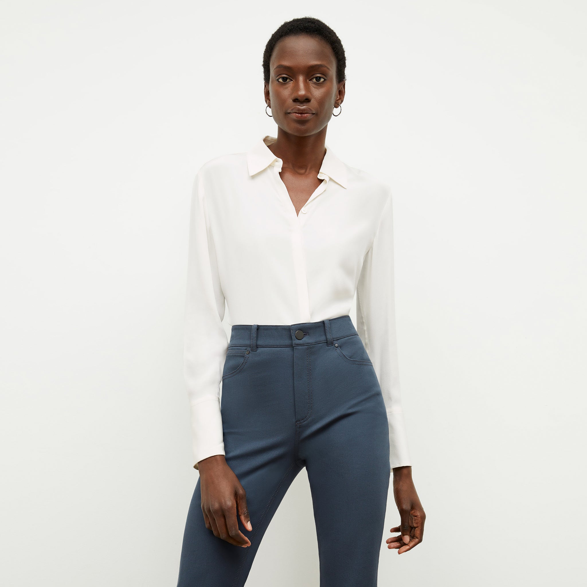 Front image of a woman wearing the tatum shirt in ivory 