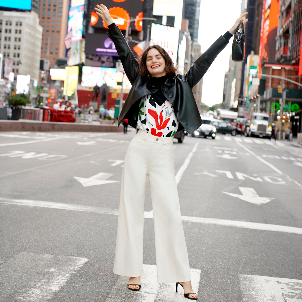 Front image of a woman wearing the nicky jacket in black