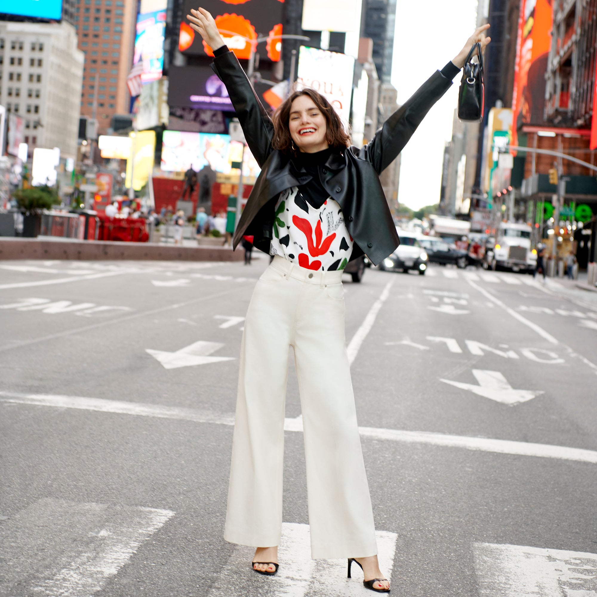 Front image of a woman wearing the nicky jacket in black