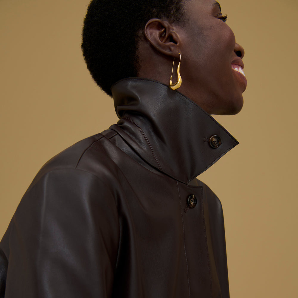 Front image of a woman wearing the Sima Earrings in Gold