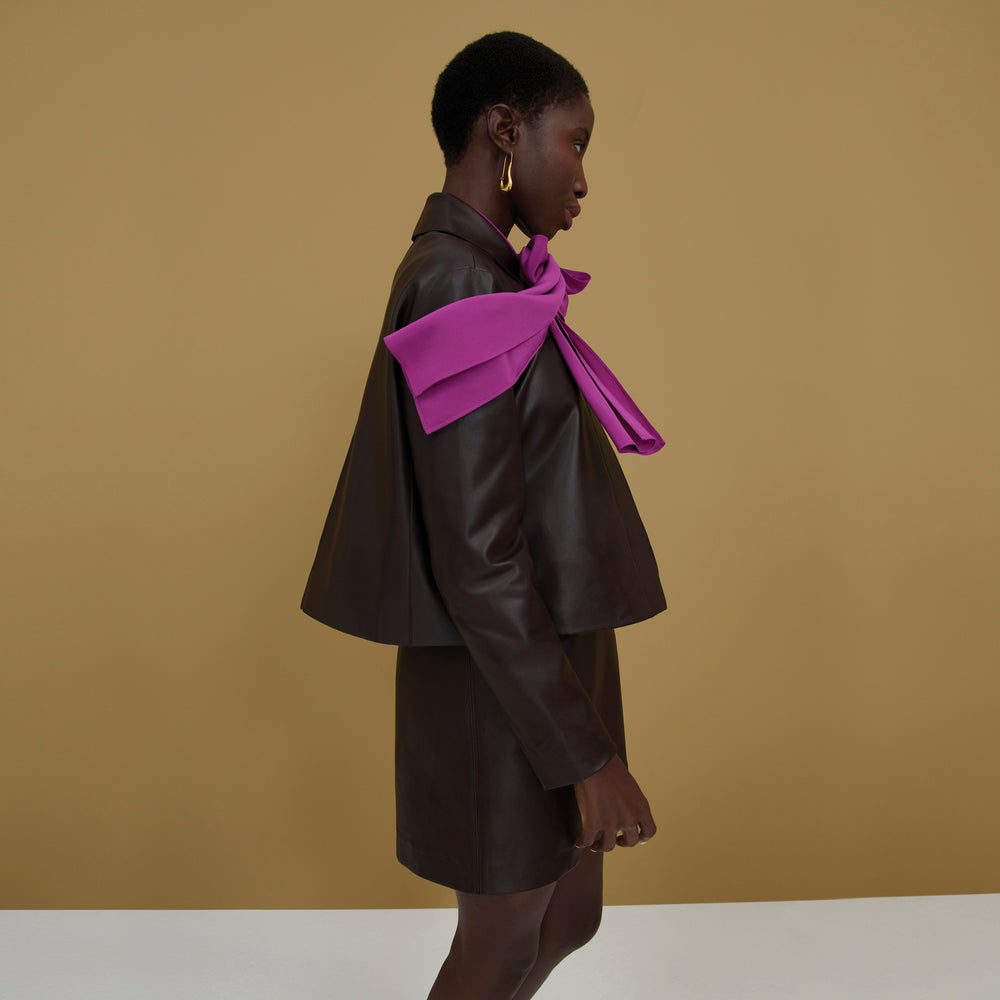 Side image of a woman wearing the Darcy Top in Purple Jasper
