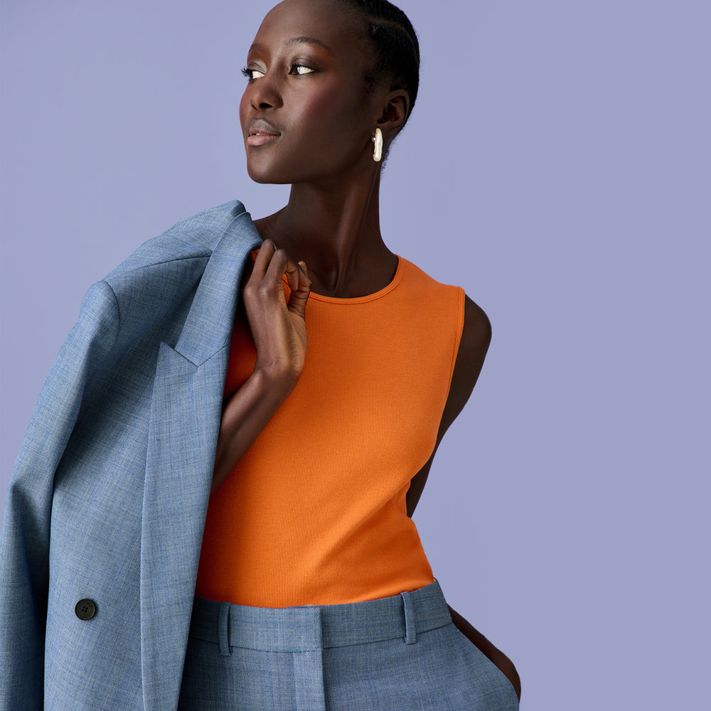 Front image of a woman with the O'Hara Blazer in Indigo and White over one shoulder