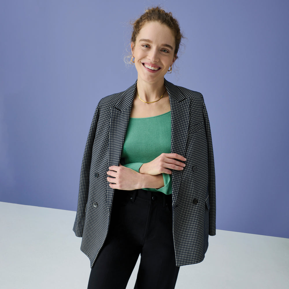 Front image of a woman wearing the joya top in spring green