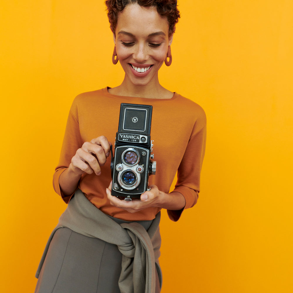 Front image of a woman wearing the Owen T-Shirt - Pima Cotton in Burnt Orange