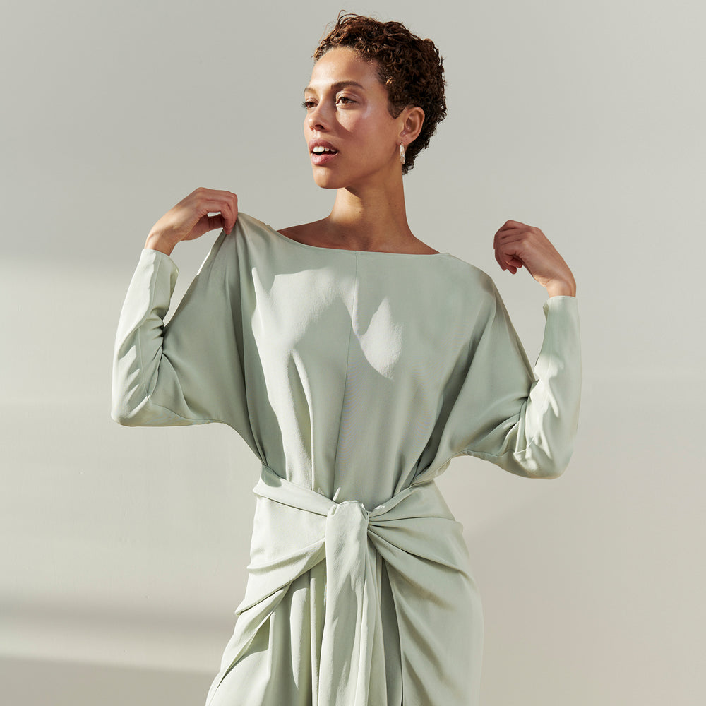 Front image of a woman wearing the Rashmeen dress in Minty Green