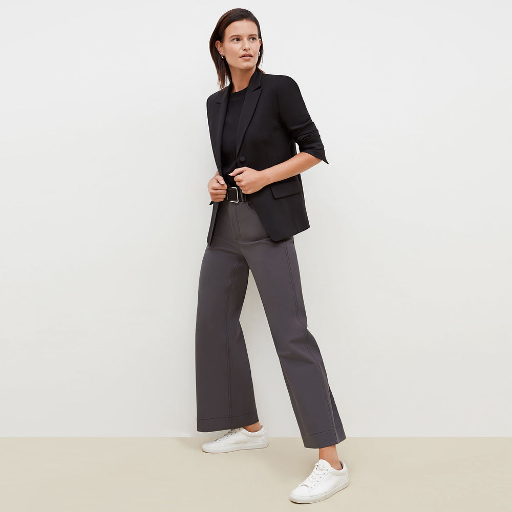 Side image of a woman standing wearing the bennett blazer wool twill in black