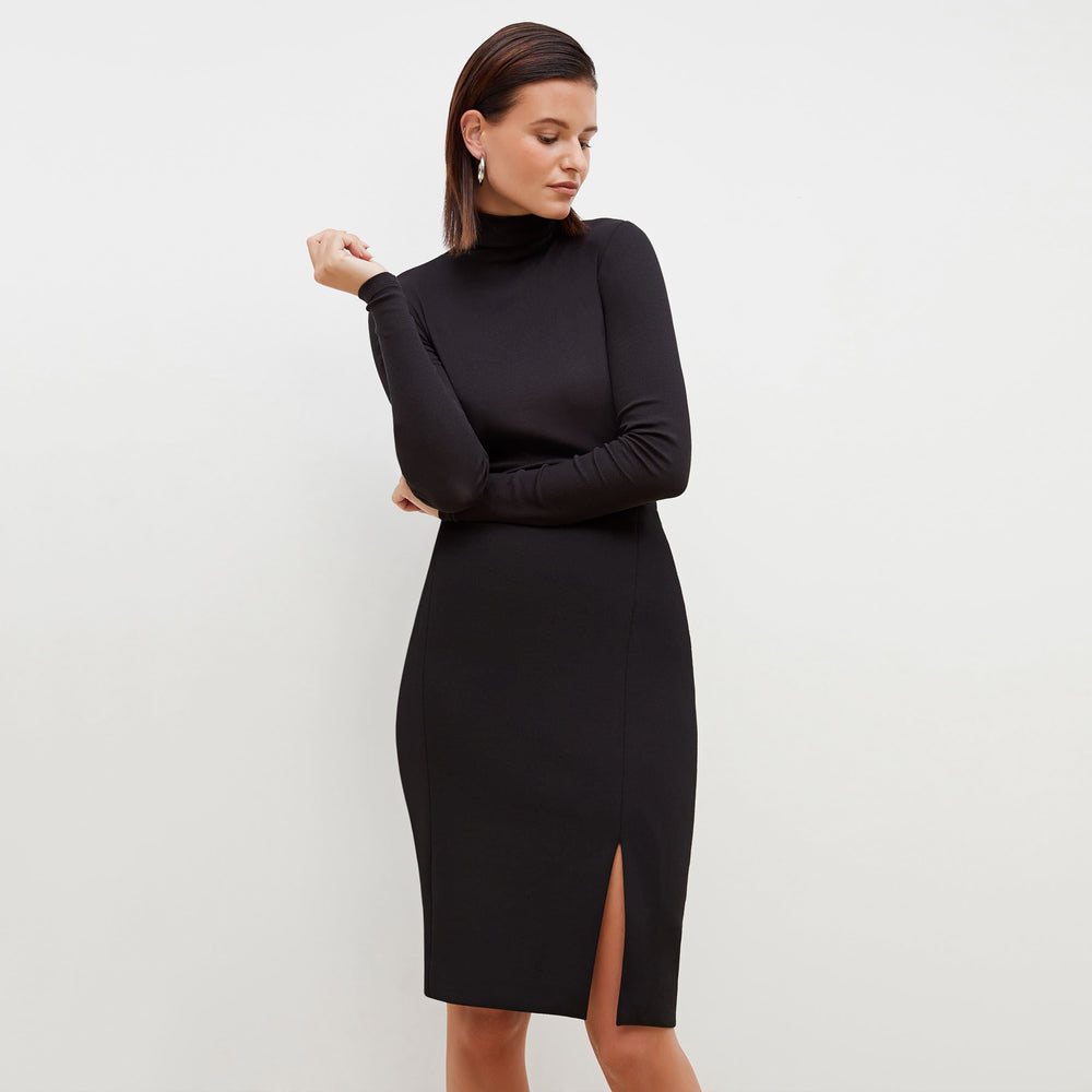 Front image of a woman standing wearing the Cortlandt Skirt--Worth in Black