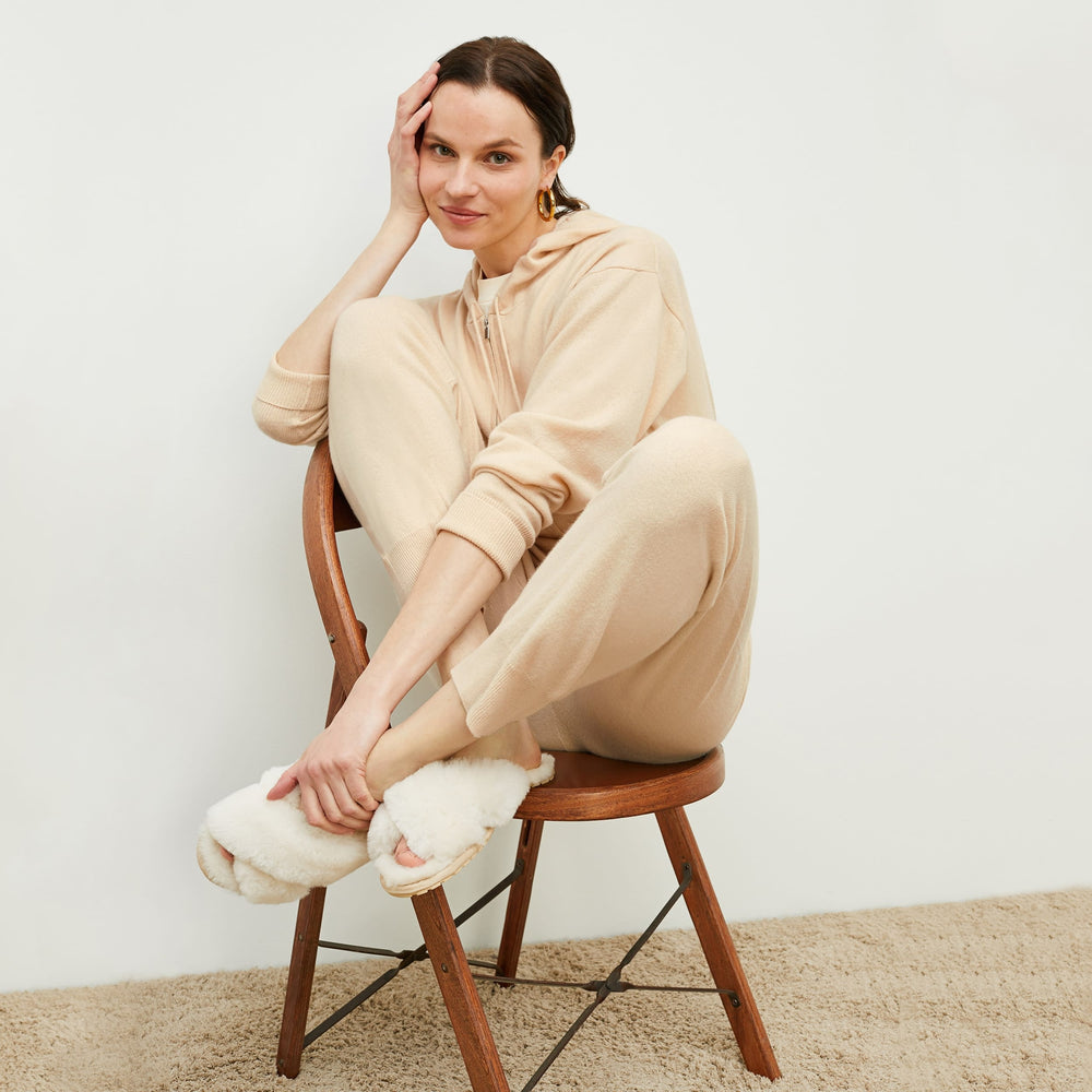 Front image of a woman standing wearing the Judith Hoodie—Cashmere in Turbinado