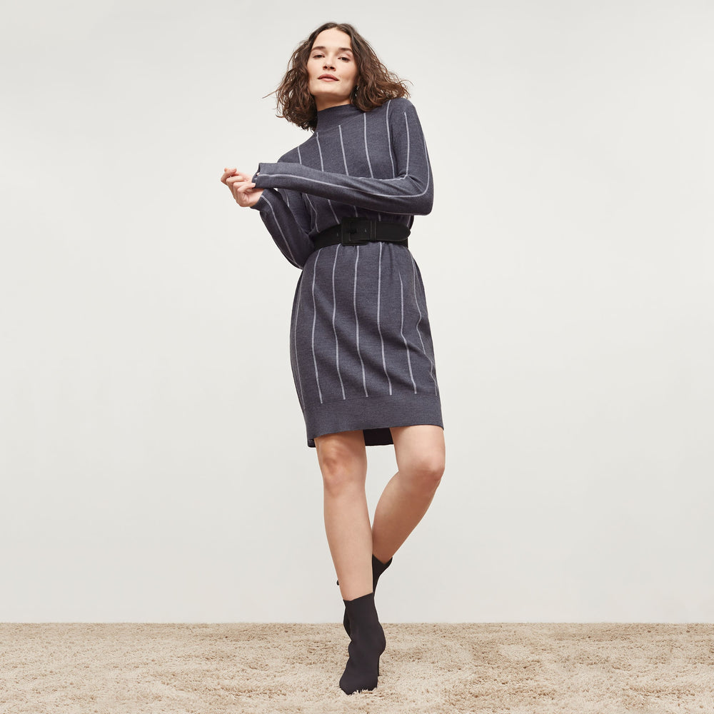 Front image of a woman standing wearing the Effy Dress—Braided Stripe in Charcoal / Ivory