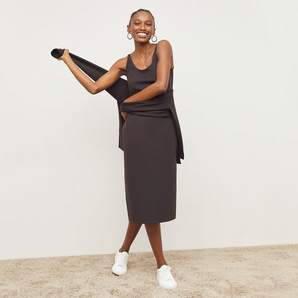 Front image of a woman standing wearing the Elsa Dress—Light Scuba in Haze