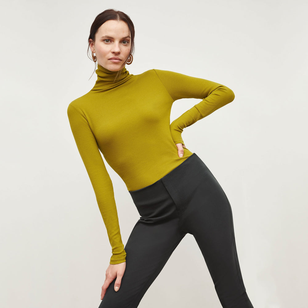Front image of a woman standing wearing the Hockley Jean in Hemlock