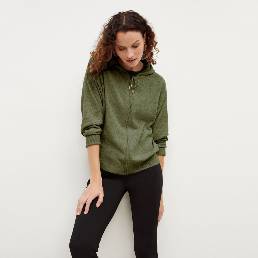 Front image of a woman standing wearing the Judith Hoodie—Cashmere in Olive