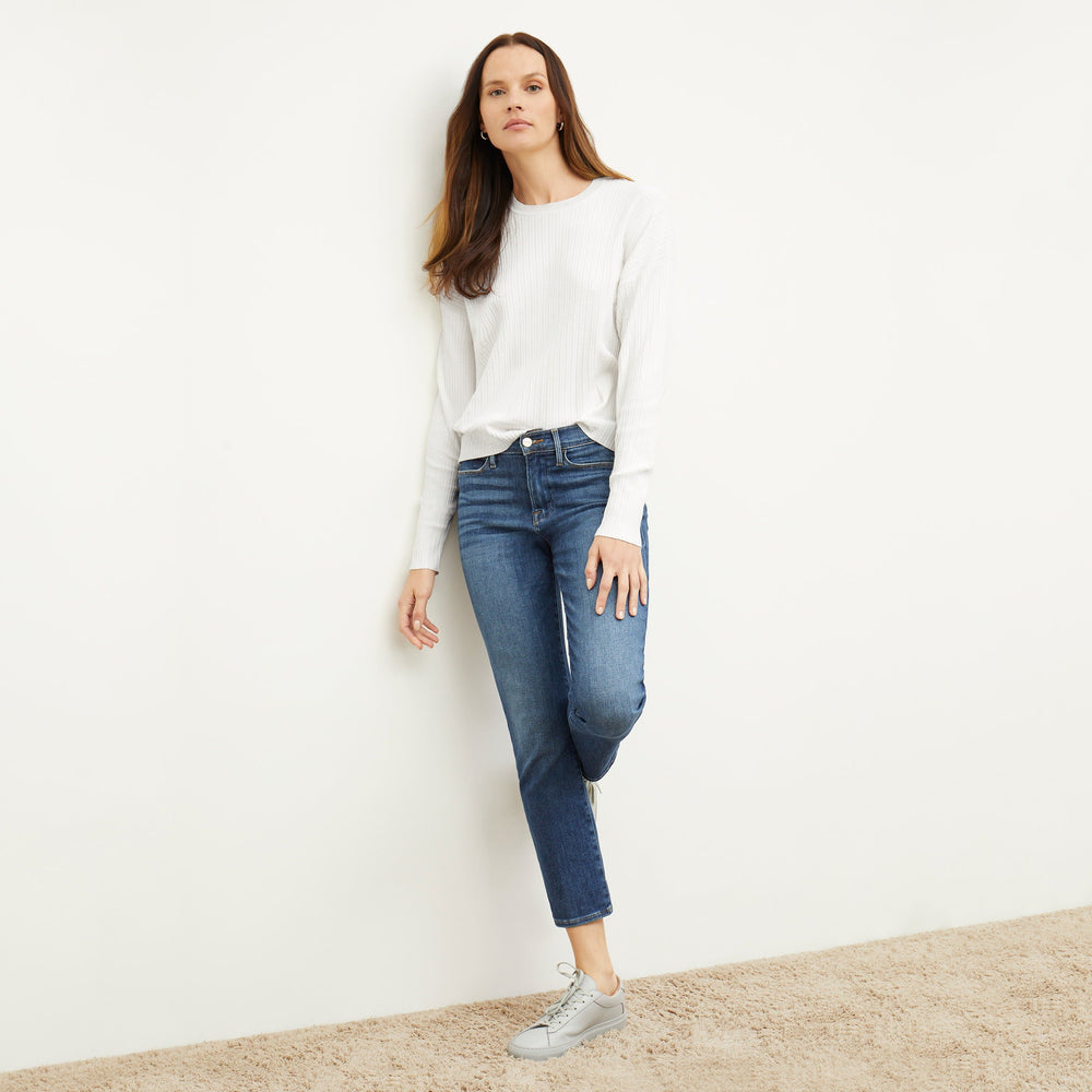 Front image of a woman standing wearing the FRAME Denim Le High Straight in Bestia