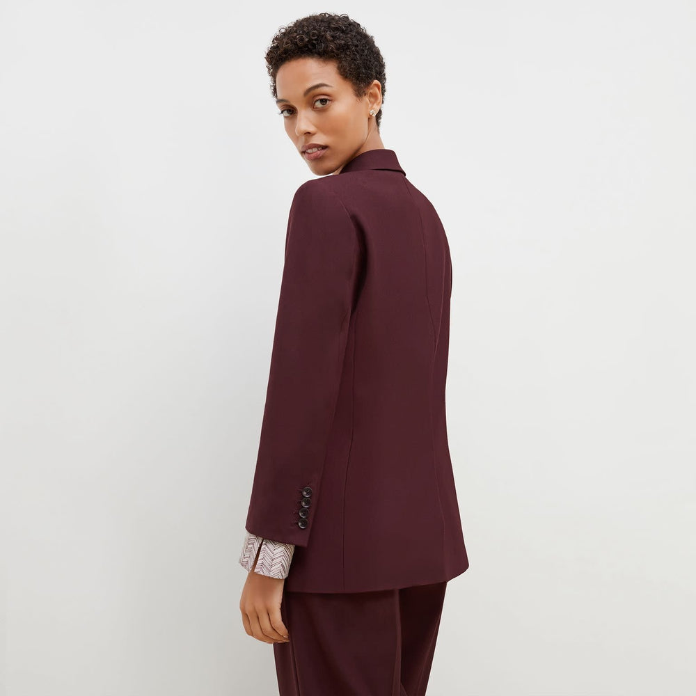 Back image of a woman standing wearing the O'Hara Blazer-Sharkskin in garnet