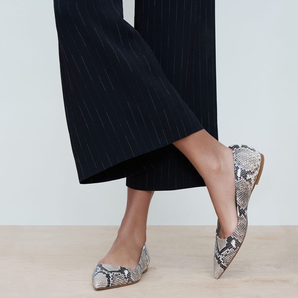 Woman standing wearing the rowan flat snakeskin