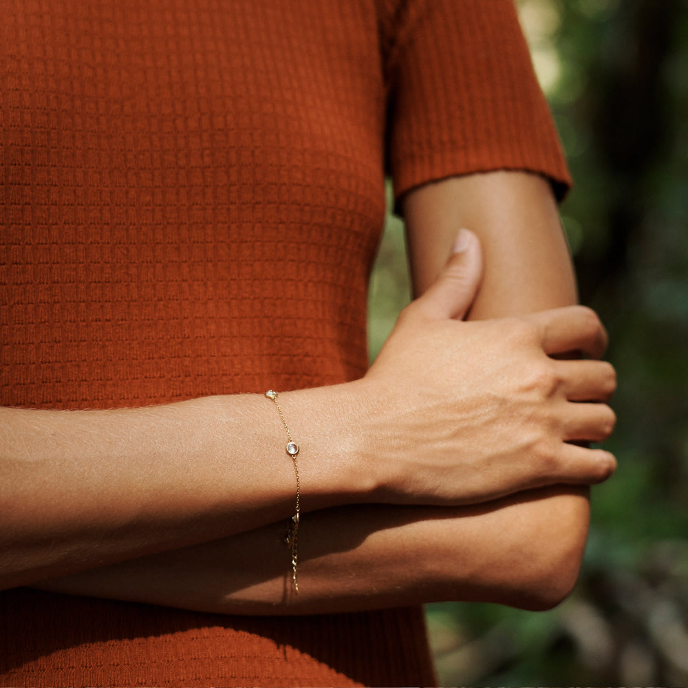 Front image of a woman standing wearing the hayden dress in canyon