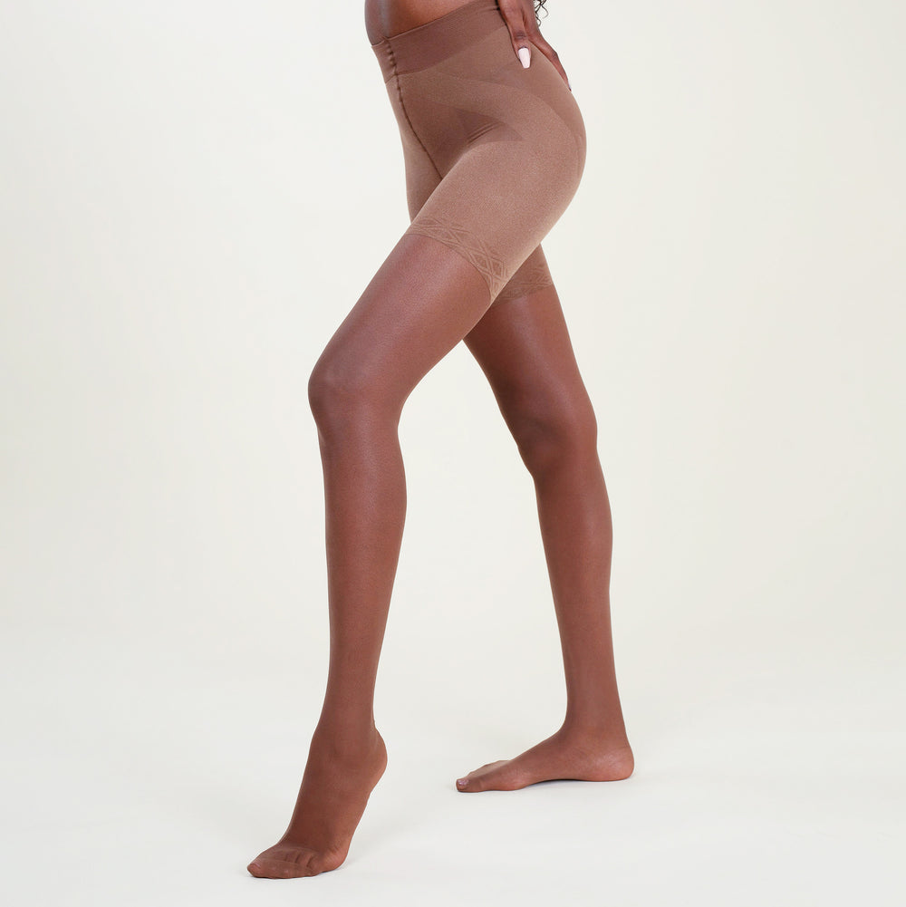 Image of a woman wearing the threads tights in sheer espresso